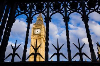 Big Ben seen through the ornate metal security gates, Westminster, UK