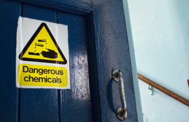 Dangerous Chemicals sticker on door