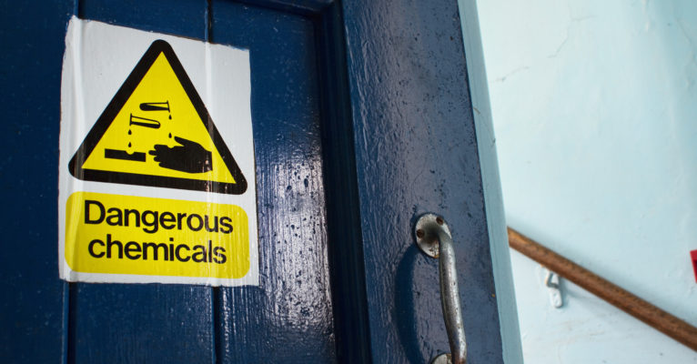 Dangerous Chemicals sticker on door