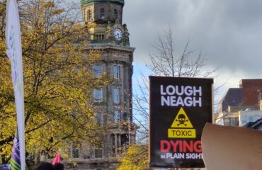 People hold placards at Save our Lough demonstration in Belfast in October 2023